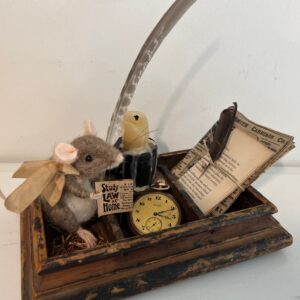 Mouse in primitive drawer with candle